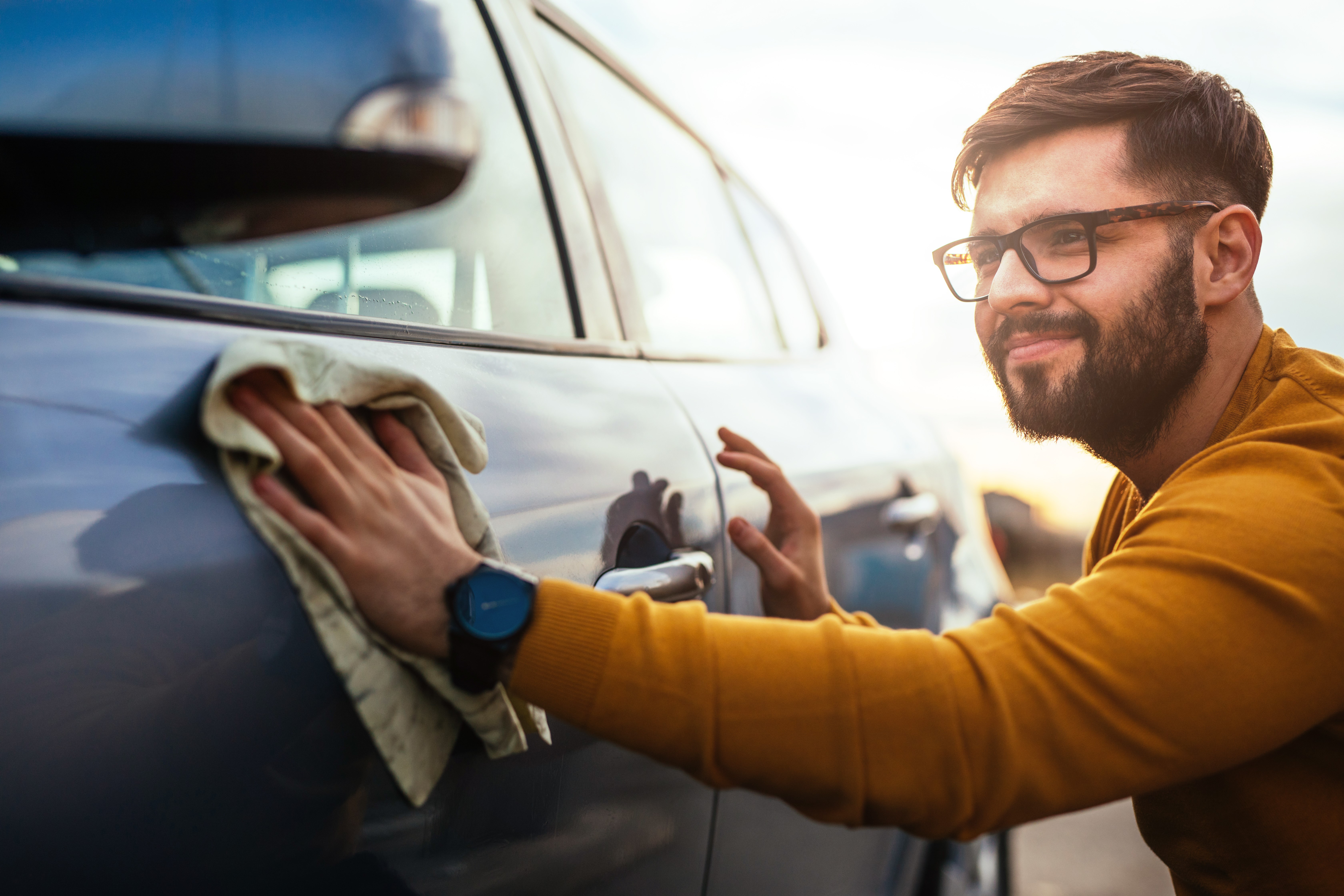 Man Admiring His Clean Car